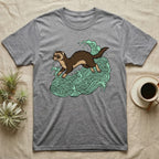 Grey t-shirt with illustration of a ferret in green waves.