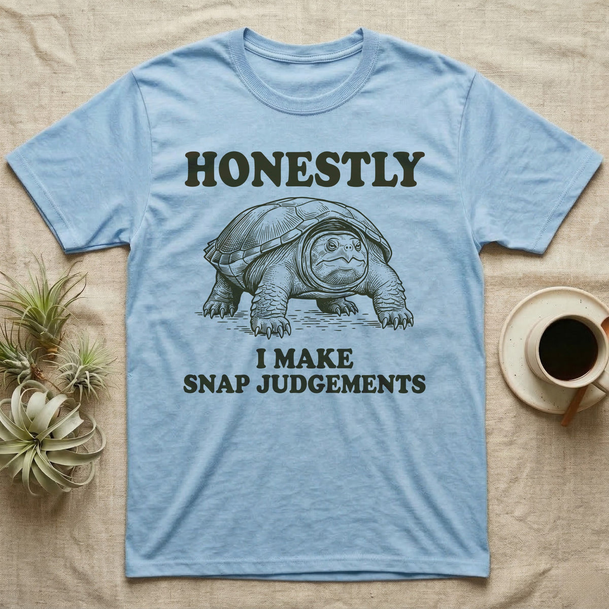 Snapping Turtle Judgements T-Shirt in Light Blue — Engraved snapping turtle standing, head forward, with the words Honestly, I Make Snap Judgements