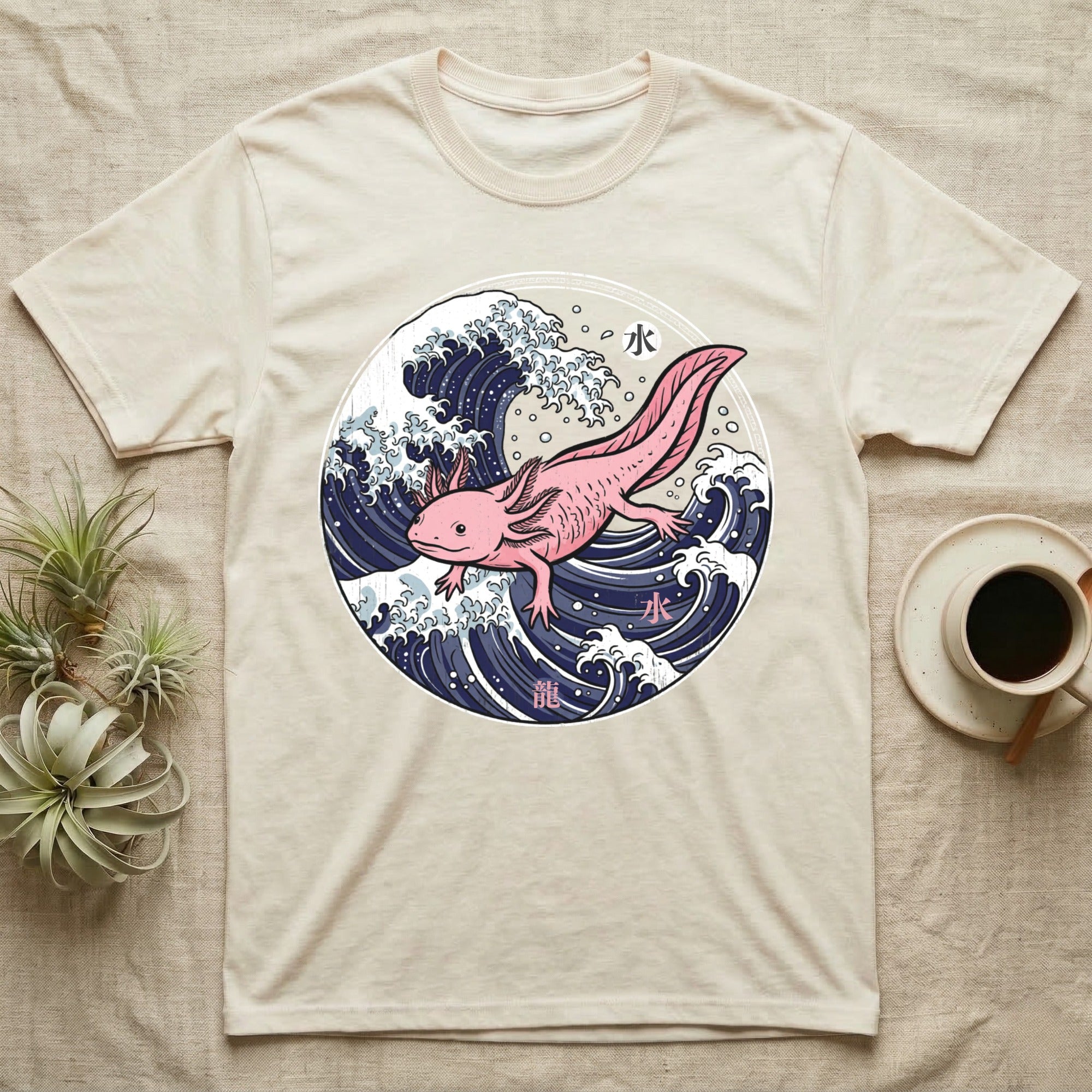 Cream t-shirt featuring a pink axolotl amidst Japanese-style waves.