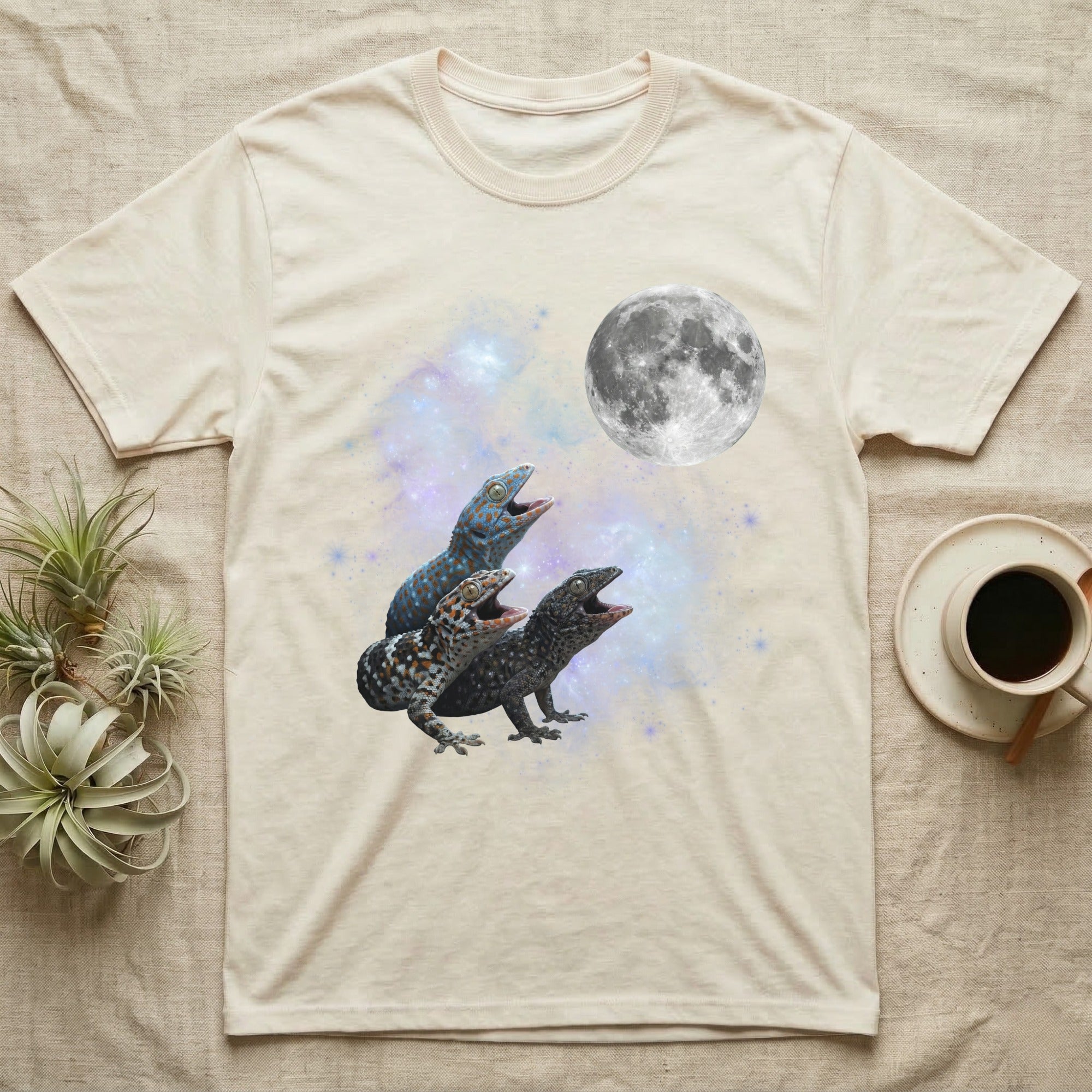 Tokay Gecko Moon Howl T-Shirt in Natural — Three Tokay Gecko colour morphs howling at a full moon over a nebula on a dark grey t-shirt.