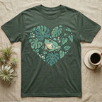 Green t-shirt with heart-shaped frog and monstera leaf design.