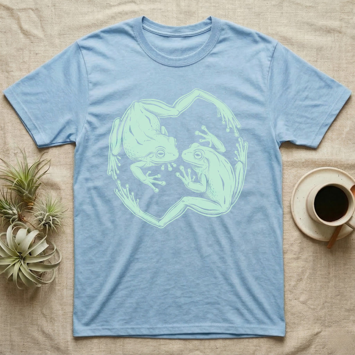 White's Tree Frog Roundel T-Shirt in Light Blue — Brush line art of two White's tree frogs facing each other, bodies curving into a circle, on grey