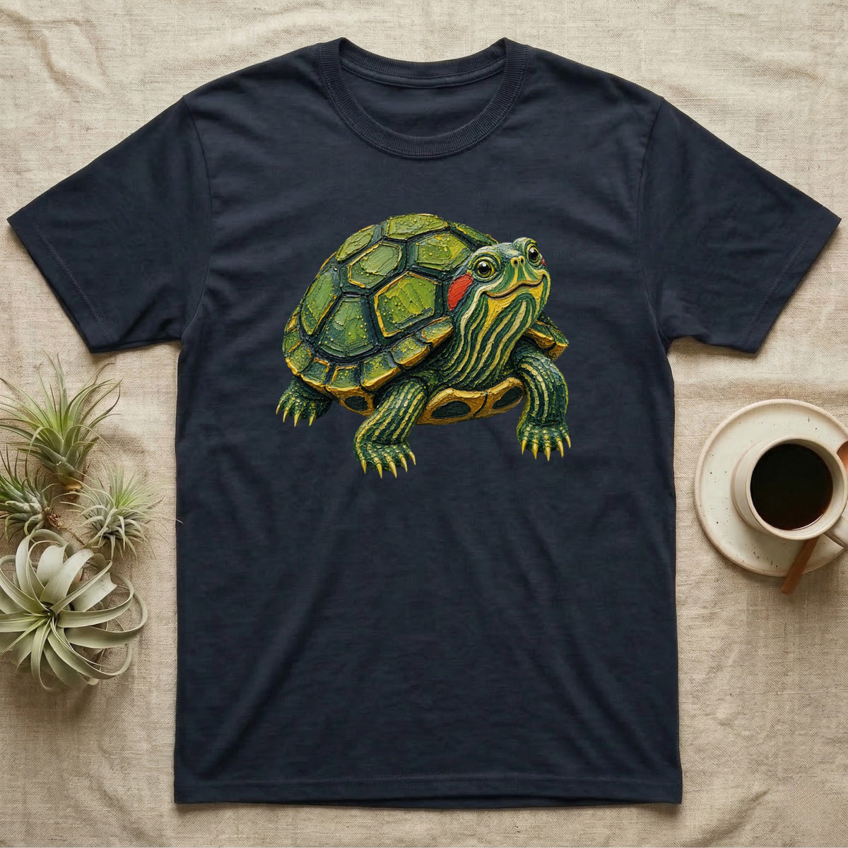Dark t-shirt with a realistic illustration of a red-eared slider turtle.