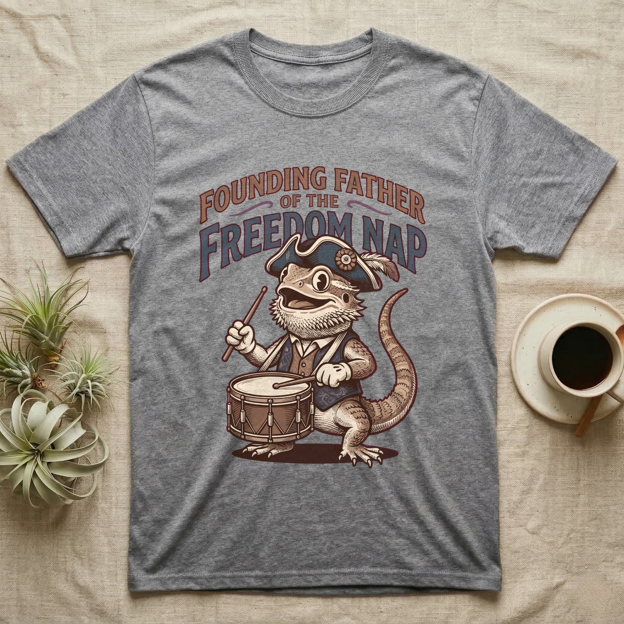 Bearded Dragon Drummer T-Shirt in Sport Grey — Sepia woodcut bearded dragon as a Revolutionary drummer boy under ornate text Founding Father of the Freedom Nap.