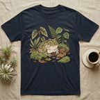 Bioactive Pacman Frog T-Shirt in Navy — Warm botanical illustration of a content pacman frog half-buried in a lush bioactive habitat of moss and leaf litter.