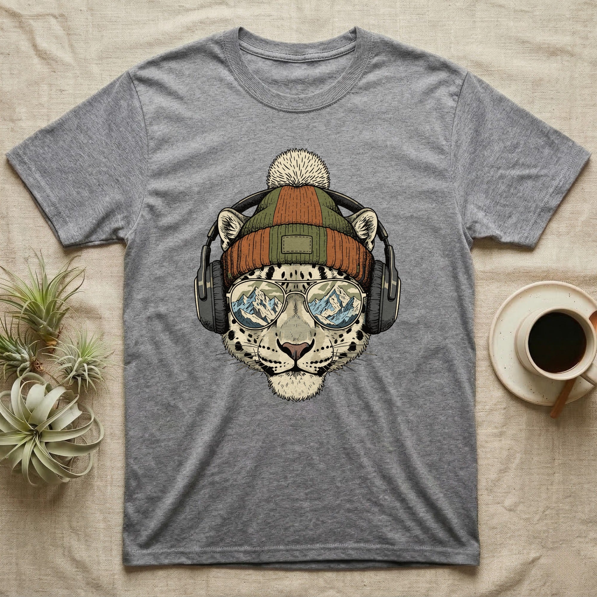 Grey t-shirt with leopard wearing headphones and sunglasses, mountain reflection.