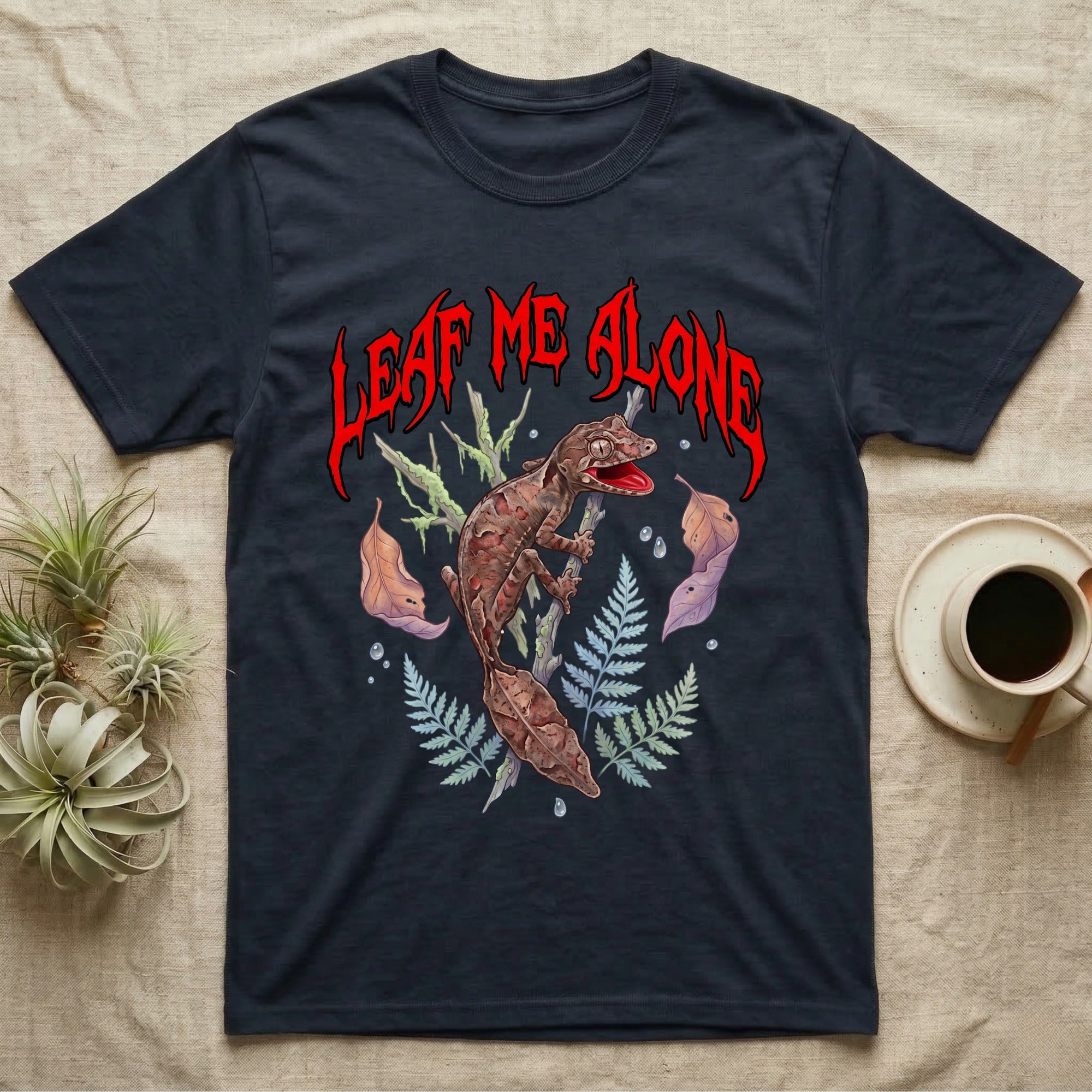 Satanic Leaf-Tailed Gecko Feral T-Shirt in Navy — Satanic leaf-tailed gecko gaping on a twig with dripping blood-red metal "Leaf Me Alone" wordmark above