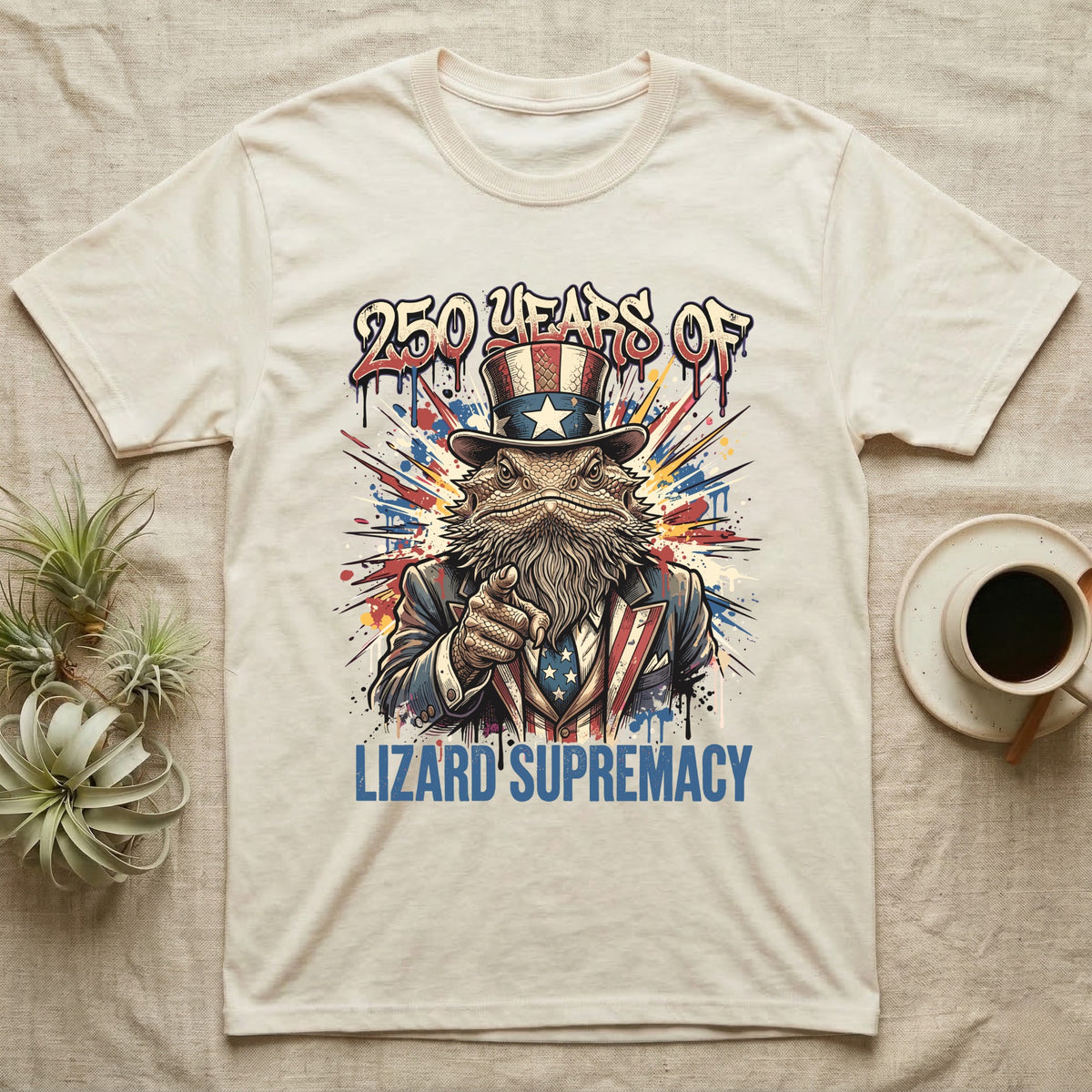 Bearded Dragon Uncle Sam T-Shirt in Natural — Splatter-art bearded dragon as Uncle Sam pointing forward under text 250 Years of Lizard Supremacy.