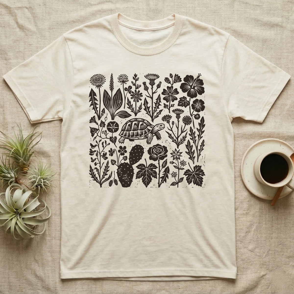 Hermann's Tortoise Forage T-Shirt in Natural — One-ink linocut of twenty forage plants with a small Hermann's tortoise walking among them