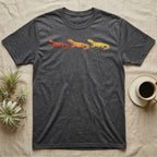 Uromastyx Colour Morph Trio T-Shirt in Dark Heather — Three uromastyx lizards in a row, painted in thick raised relief — brick red, tangerine orange and lemon yellow morphs.