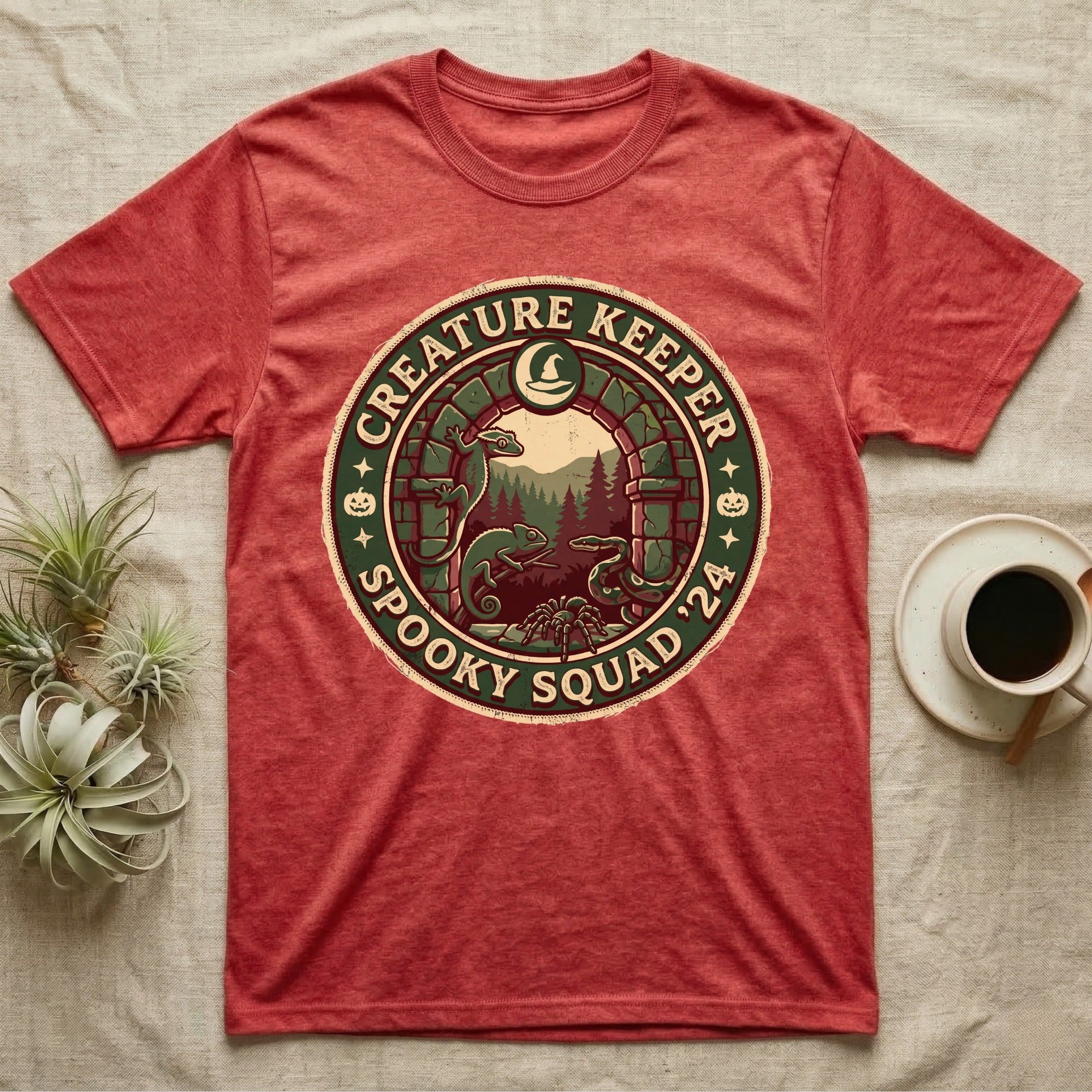 Creature Keeper Spooky Squad T-Shirt in Heather Red — Embroidered-patch badge with a gecko, chameleon, snake and tarantula in a stone archway, "Creature Keeper Spooky Squad."