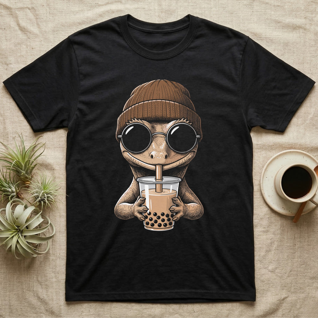 Crested Gecko Boba Tea T-Shirt in Black — Cross-hatch engraving of a crested gecko in a beanie and round glasses sipping boba milk tea.