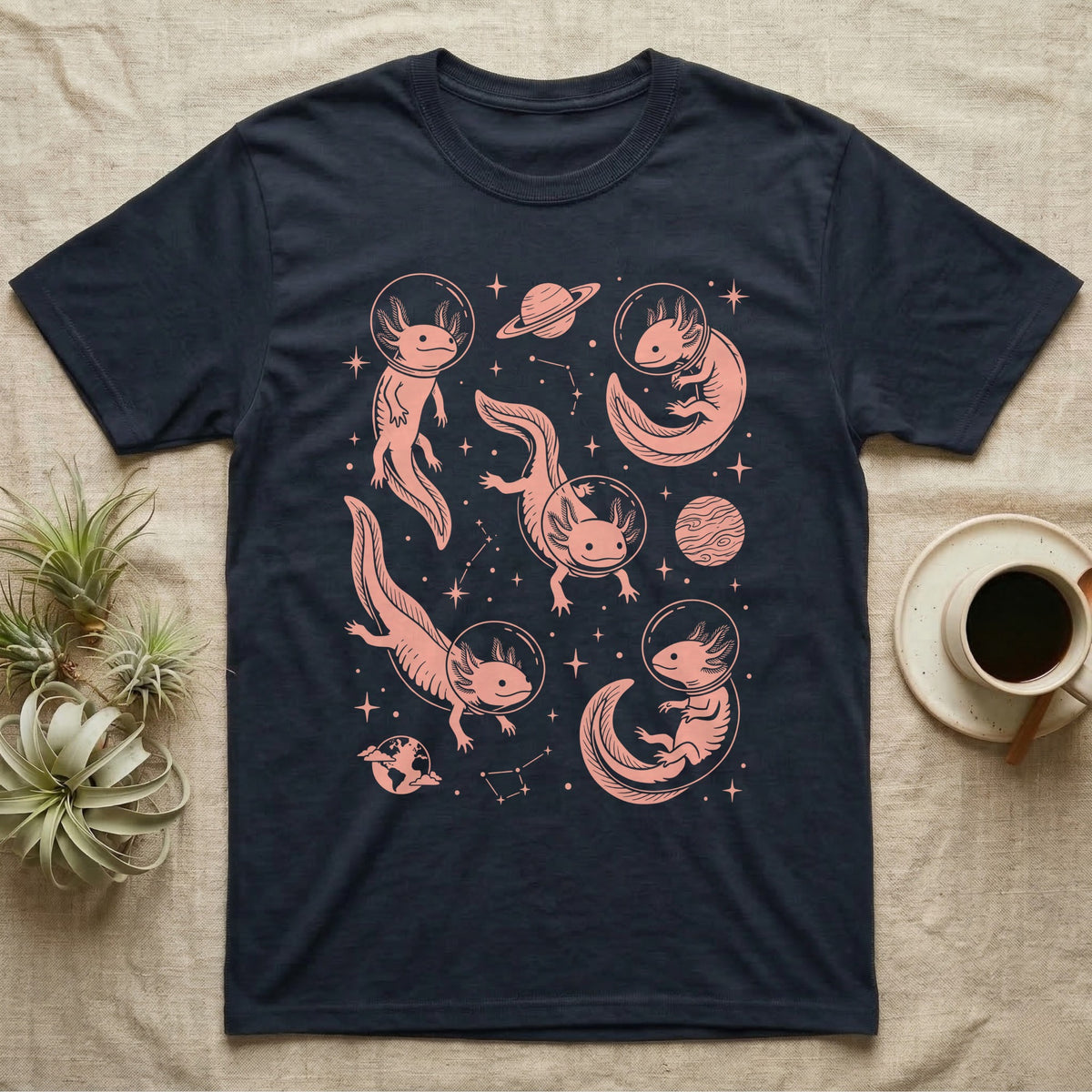 Axolotl Cosmic T-Shirt in Navy — Vintage screen-print illustration of axolotls in astronaut helmets floating in space, soft coral monochromatic on dark background.