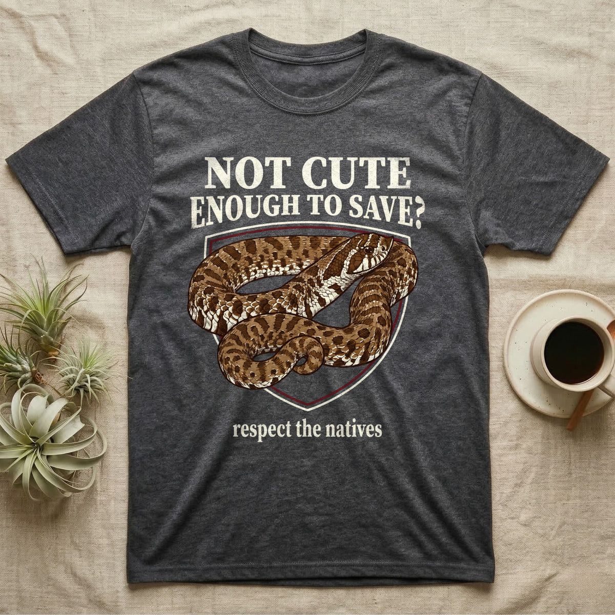 Hognose Snake Conservation T-Shirt in Dark Heather — Vintage-poster illustration of a western hognose snake portrait in a sepia crest with conservation banner text.