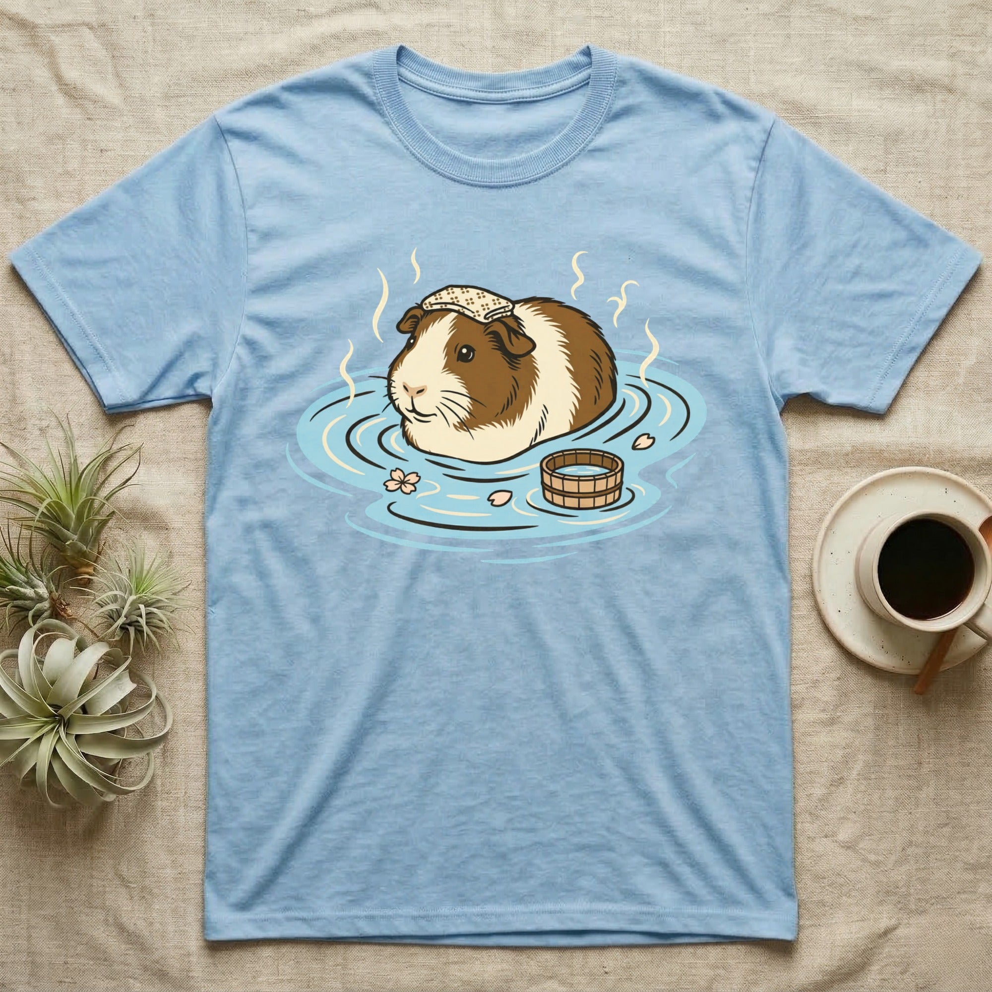 Light blue t-shirt with guinea pig relaxing in a hot spring.