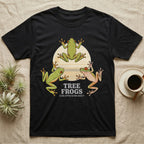 Three Tree Frog Moon T-Shirt in Black — Retro-illustration of three tree frogs in splayed glass-cling poses around a stratified halftone full moon.
