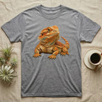 Grey t-shirt with a detailed illustration of an orange bearded dragon.