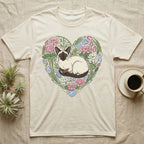 Cream t-shirt with Siamese cat and floral heart graphic.