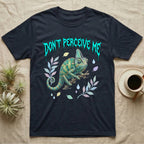 Veiled Chameleon Feral T-Shirt in Navy — Veiled chameleon on a branch with swivelling eyes under a jagged turquoise metal "DON'T PERCEIVE ME" wordmark.