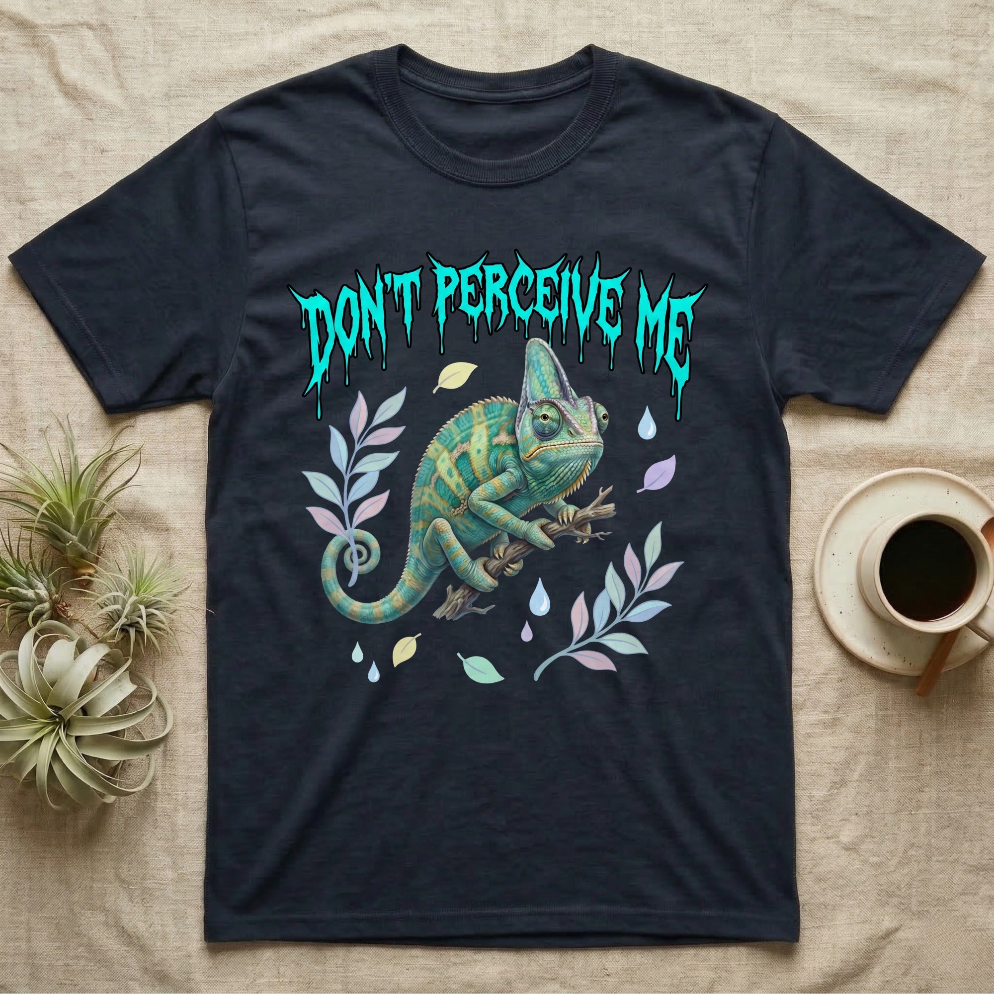 Veiled Chameleon Feral T-Shirt in Navy — Veiled chameleon on a branch with swivelling eyes under a jagged turquoise metal "DON'T PERCEIVE ME" wordmark.