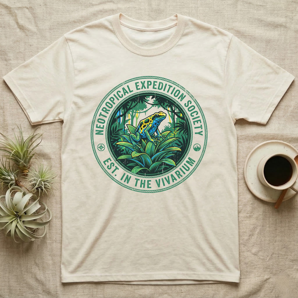Cream t-shirt featuring a circular "Neotropical Expedition Society" logo with a colorful frog.