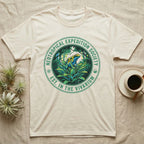 Cream t-shirt featuring a circular "Neotropical Expedition Society" logo with a colorful frog.