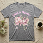 Orchid Mantis Softie T-Shirt in Sport Grey — Pink orchid mantis mimicking a flower under pastel bubble text "just a flower" with tiny hearts.