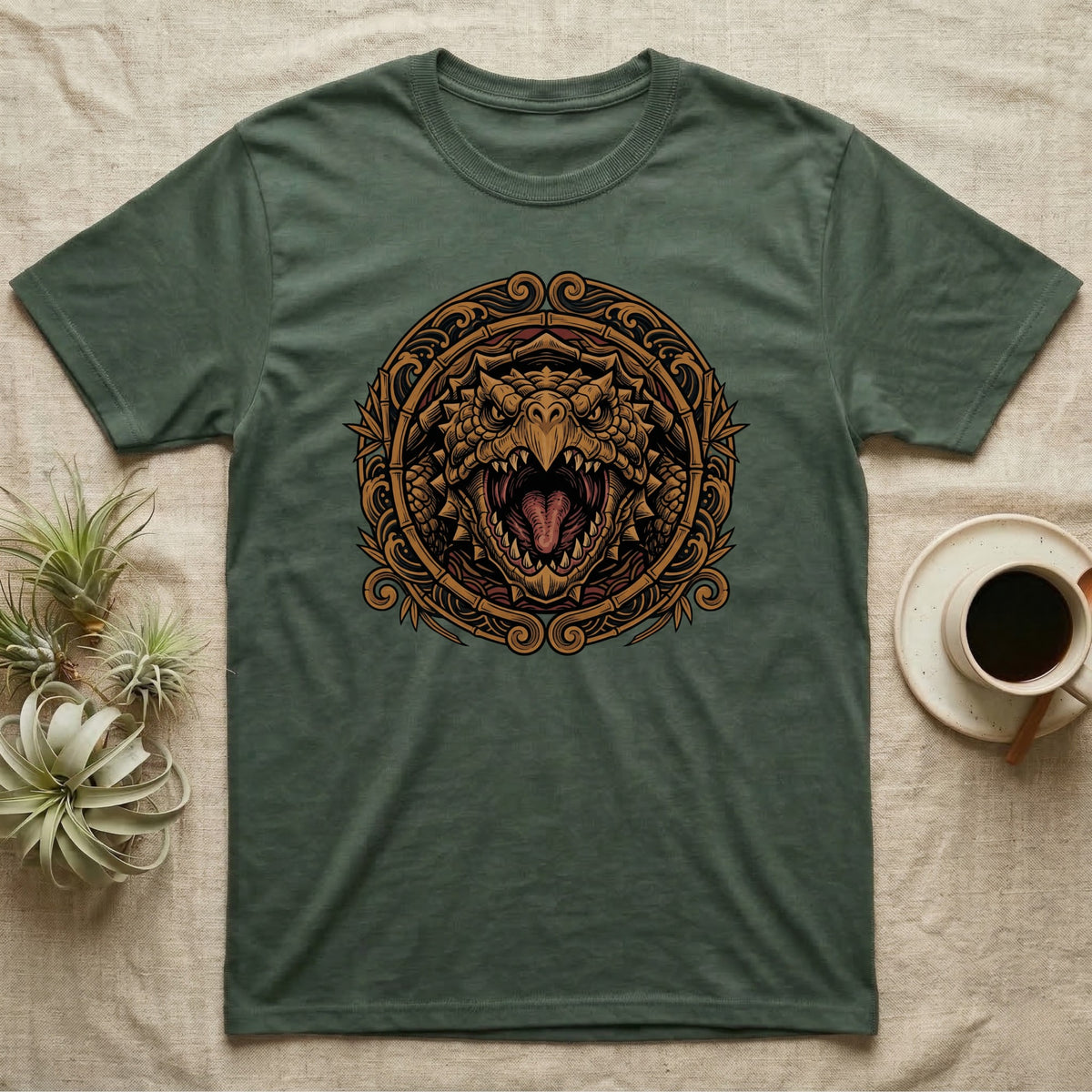 Green t-shirt with a circular, ornate dragon head design.