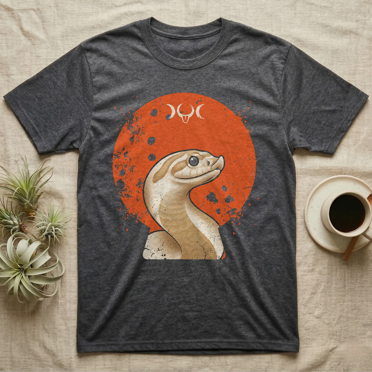 Western Hognose Disc Portrait T-Shirt in Dark Heather — Western hognose snake bust portrait on a flat distressed orange disc in warm sand tones on grey