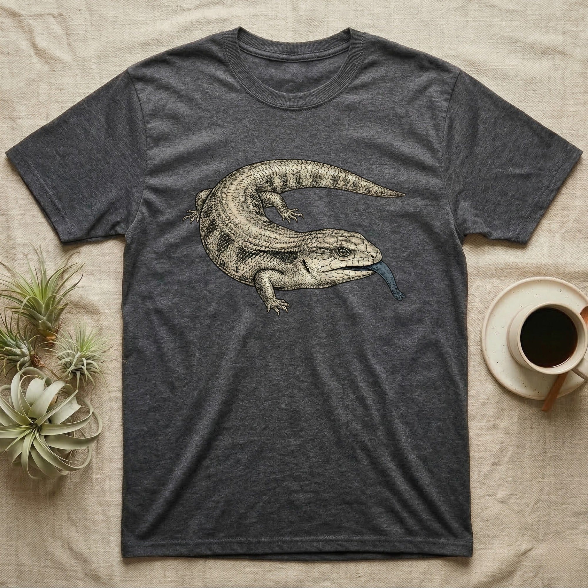 Dark grey t-shirt with a blue-tongued skink graphic on the chest.
