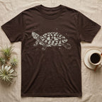 Red-Eared Slider Bleach T-Shirt in Dark Chocolate — Red-eared slider in side view basking with its neck stretched out, made of pale bleach spatter on black