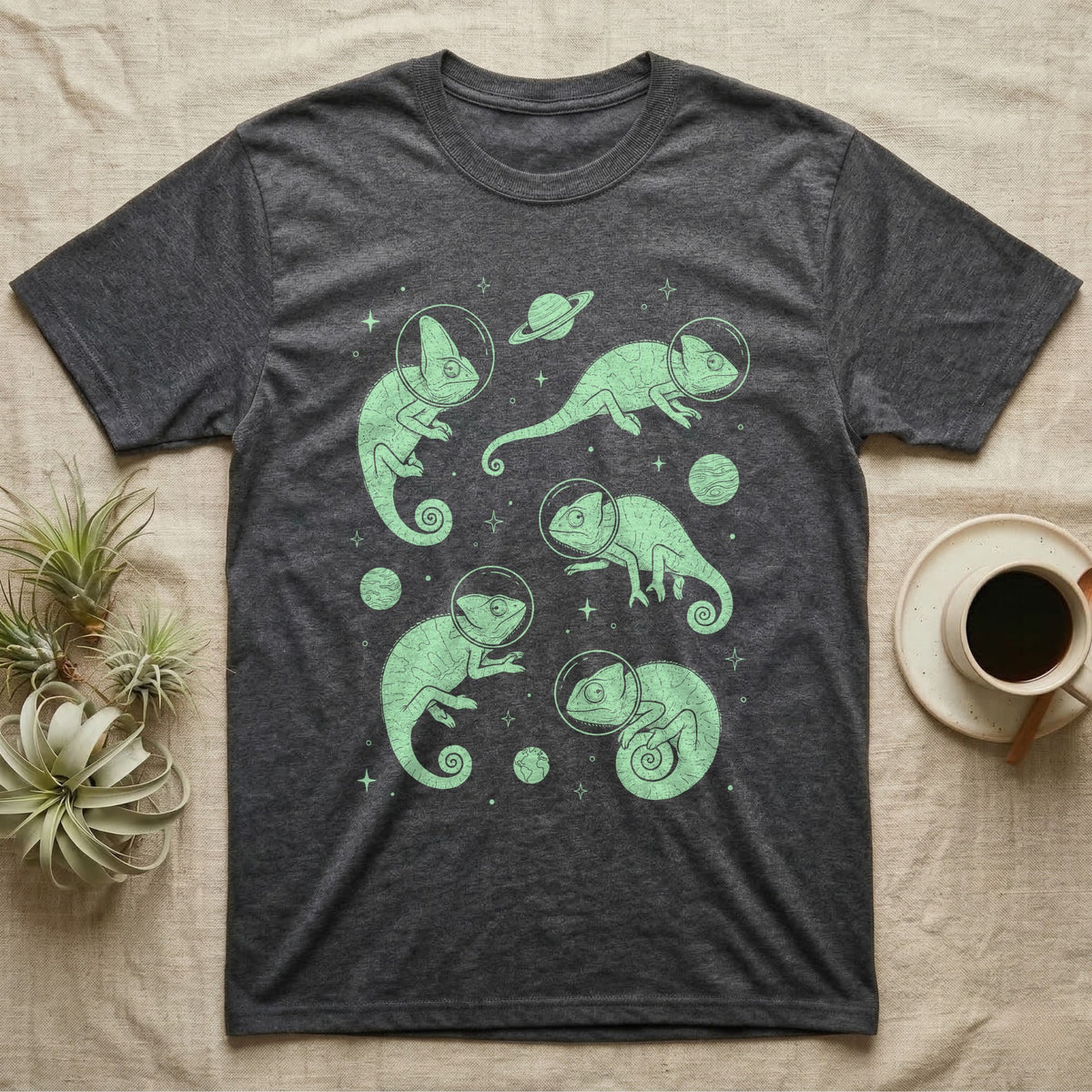 Veiled Chameleon Cosmic T-Shirt in Dark Heather — Vintage screen-print illustration of veiled chameleons in astronaut helmets floating in space, cosmic nebula mint green monochromatic on dark background.