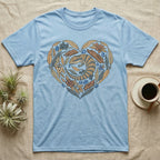 Light blue t-shirt with a heart-shaped design of a lizard and floral elements.