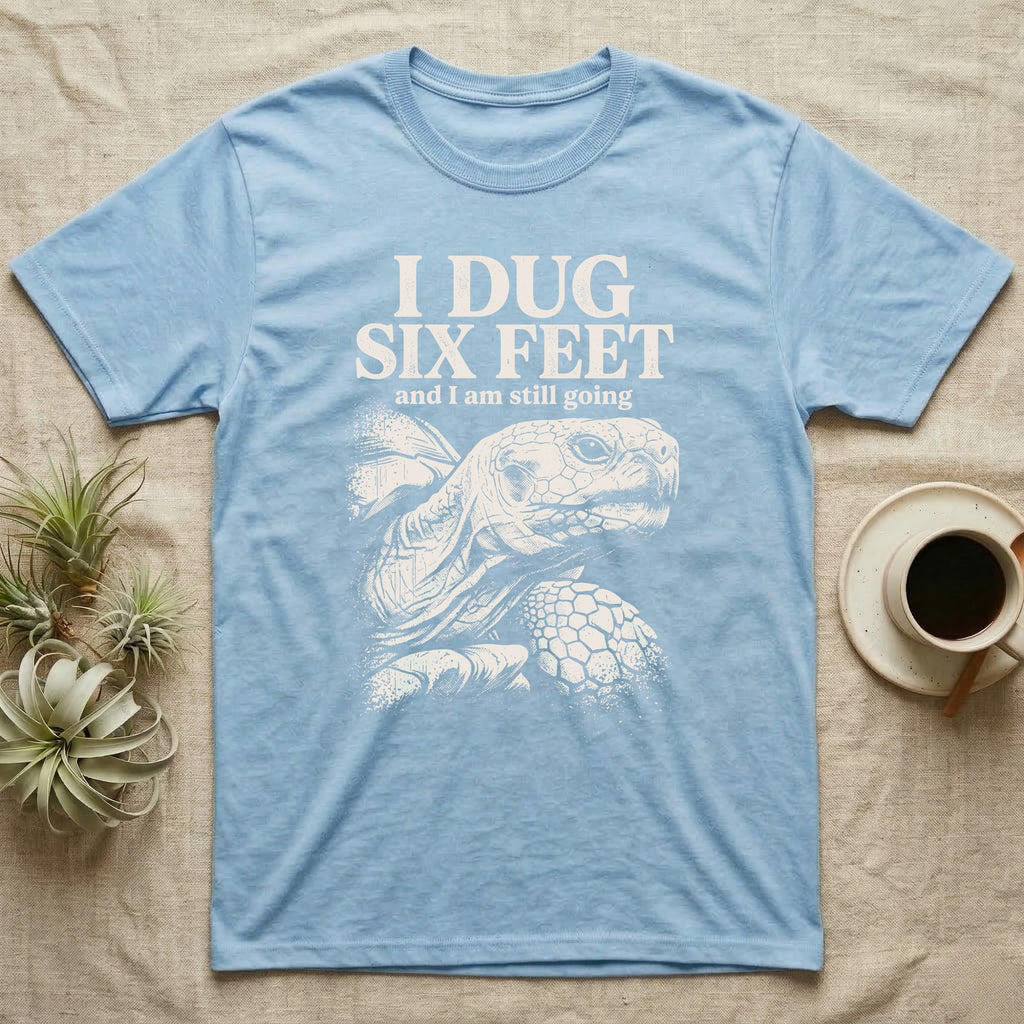 Sulcata Tortoise Dug Six Feet T-Shirt in Light Blue — One-ink white sulcata tortoise portrait on black under the words I DUG SIX FEET and I am still going.