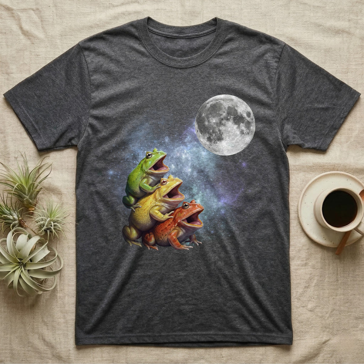 Pacman Frog Moon Howl T-Shirt in Dark Heather — Three Pacman Frog colour morphs howling at a full moon over a nebula on a dark grey t-shirt.