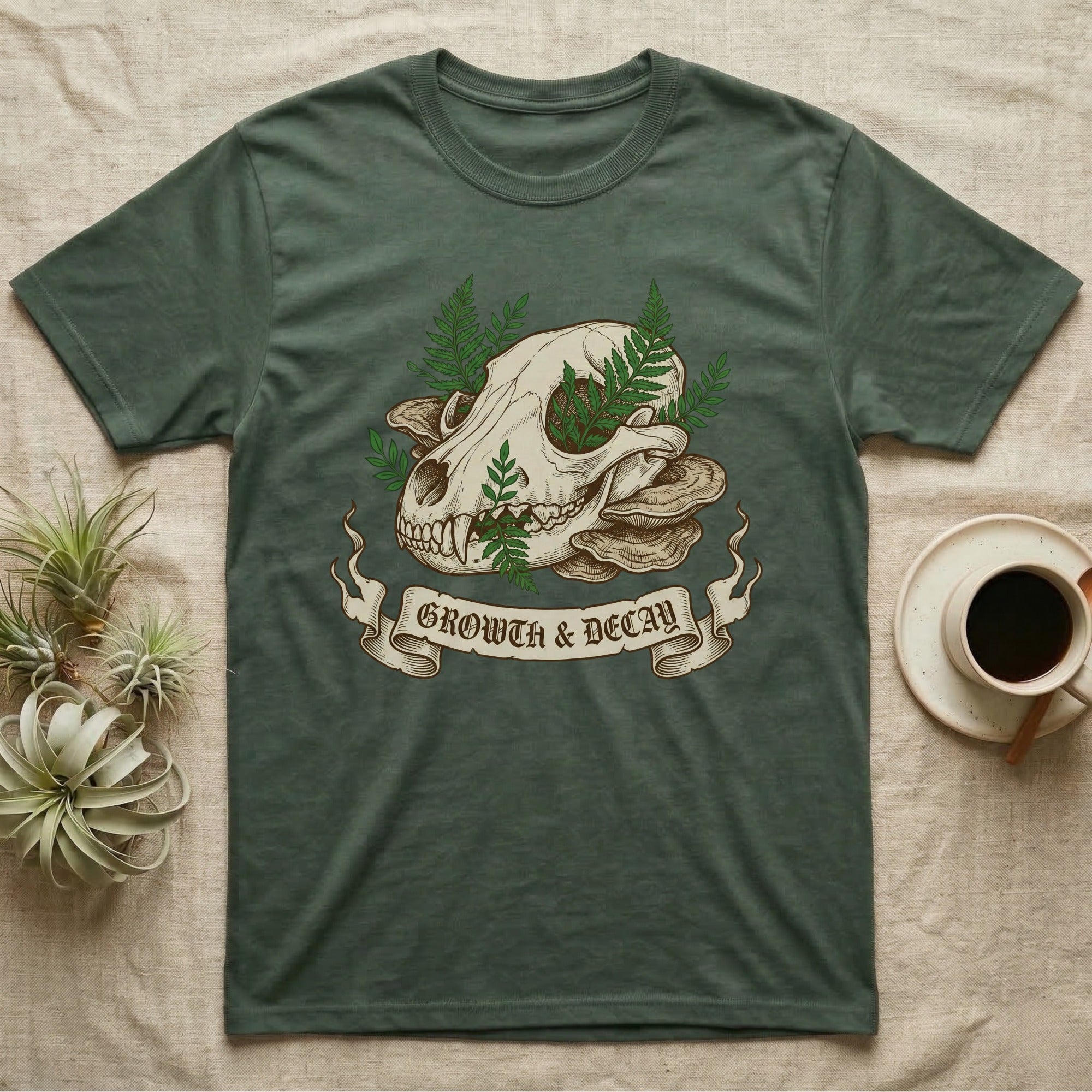Green t-shirt with skull, ferns, and mushrooms, "Growth & Decay" banner.