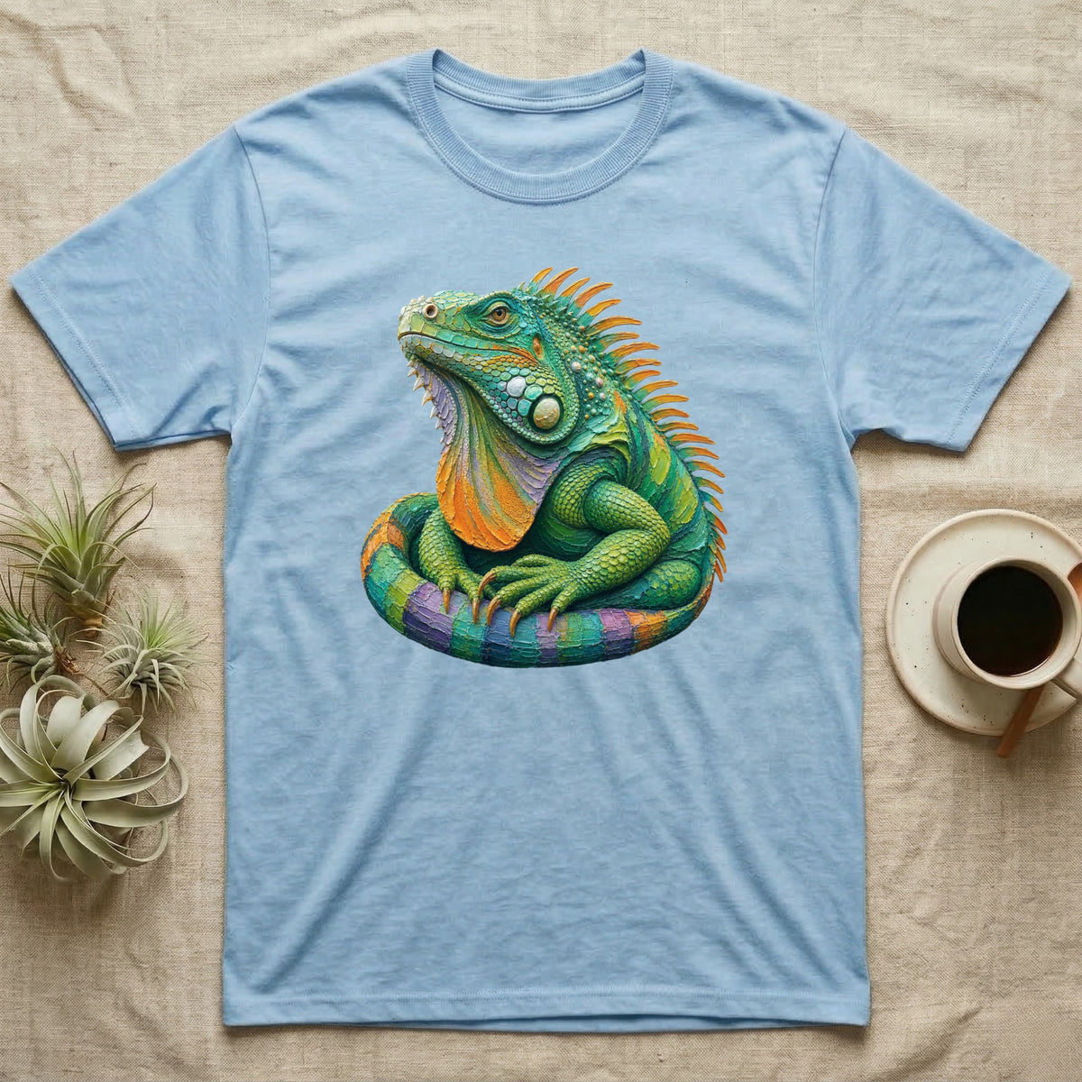 Light blue t-shirt with a colorful iguana graphic.