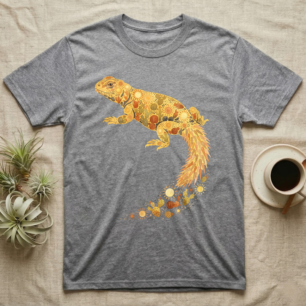 Uromastyx Solar Loaf T-Shirt in Sport Grey — Warm watercolour mosaic of a basking uromastyx lizard made of tiny suns, cacti and sand on grey
