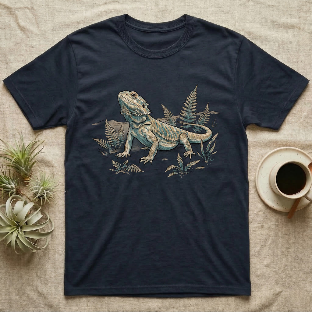 Bearded Dragon Dinosaur T-Shirt in Navy — Faded 90s nature-doc illustration of a bearded dragon posed in profile as a tiny dinosaur specimen on a field plate.