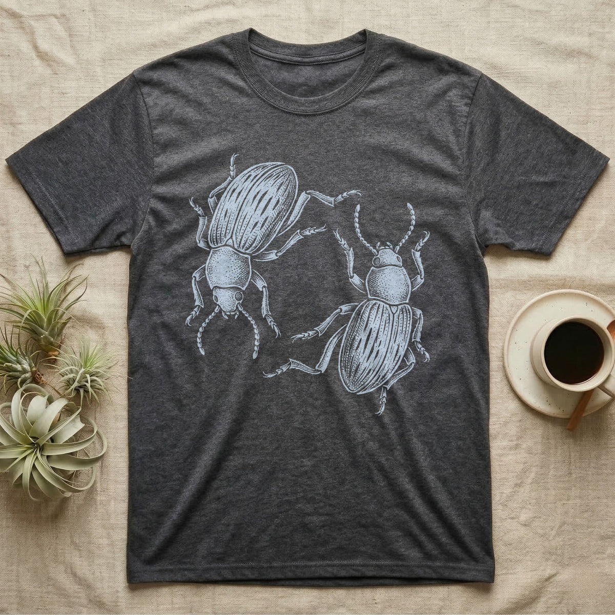 Death-Feigning Beetle Roundel T-Shirt in Dark Heather — Two blue death-feigning beetles in pale blue brush line art, rotated 180 degrees into a circle closed by their own bodies.