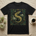 Black t-shirt with a green and gold lizard, lilies, and "The Cobalt Lizard" text.