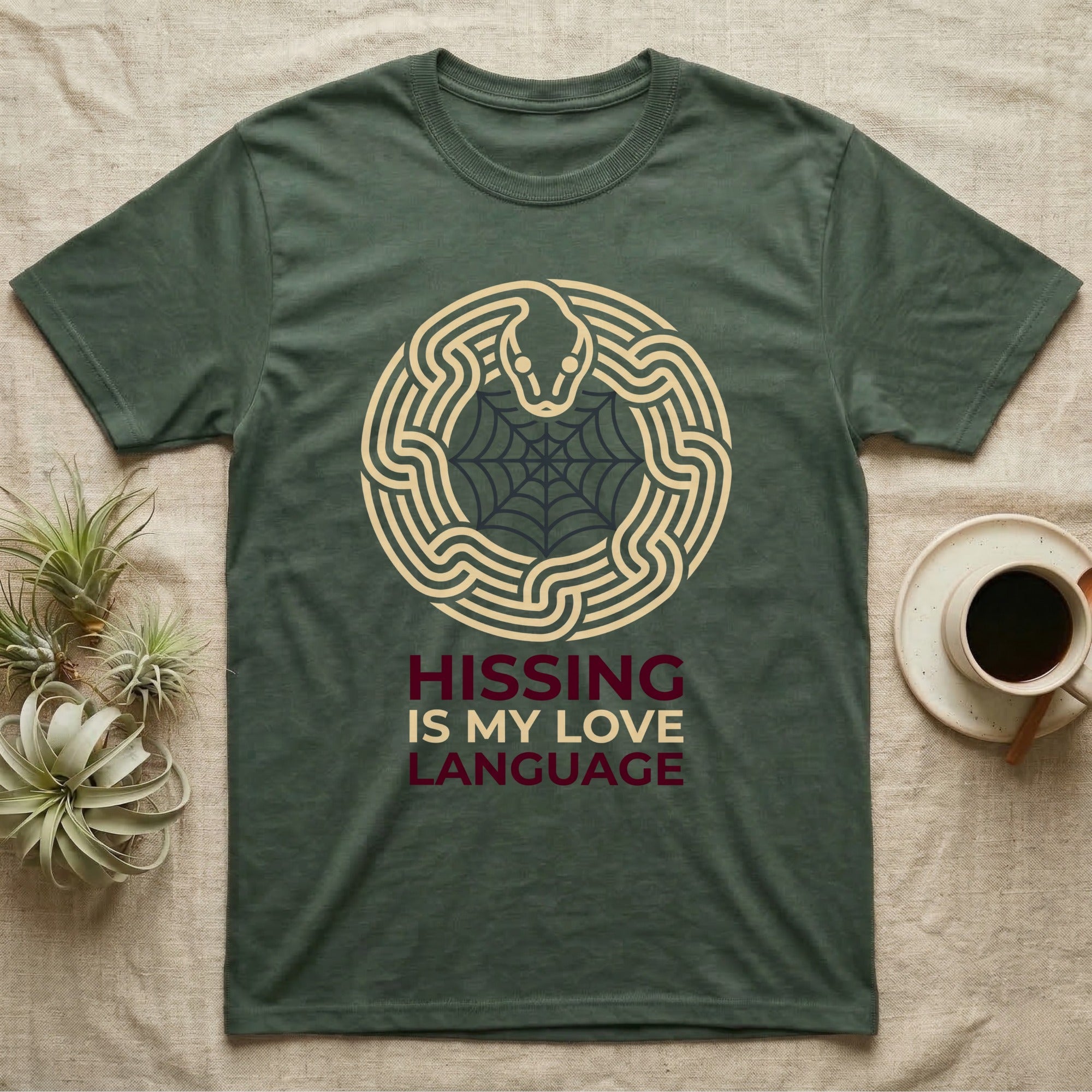 Ball Python Hissing Spiderweb T-Shirt in Military Green — Minimal continuous-line ball python coiled around a faint spiderweb, "Hissing Is My Love Language."