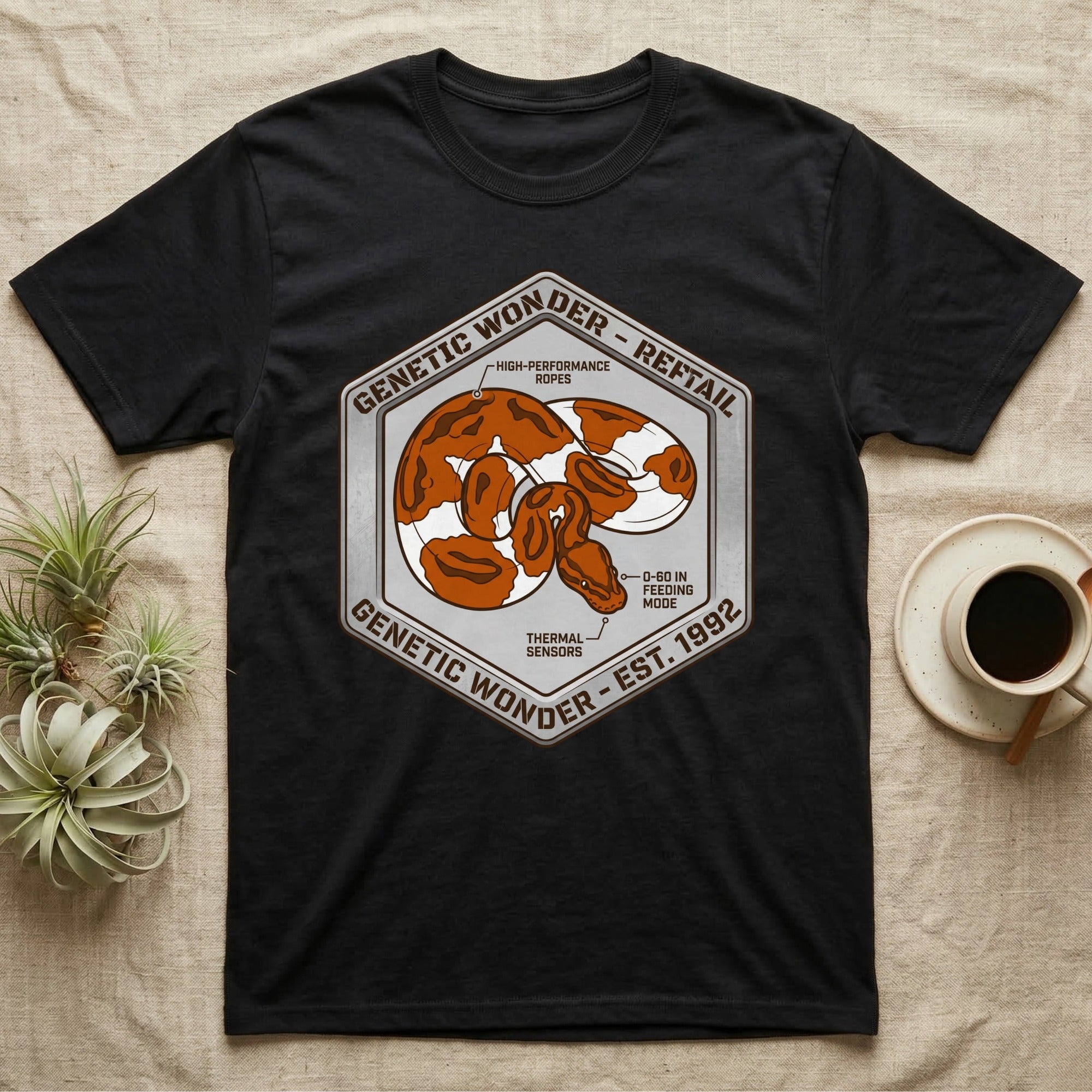 Black t-shirt with snake graphic and "Genetic Wonder - Reftail" text.