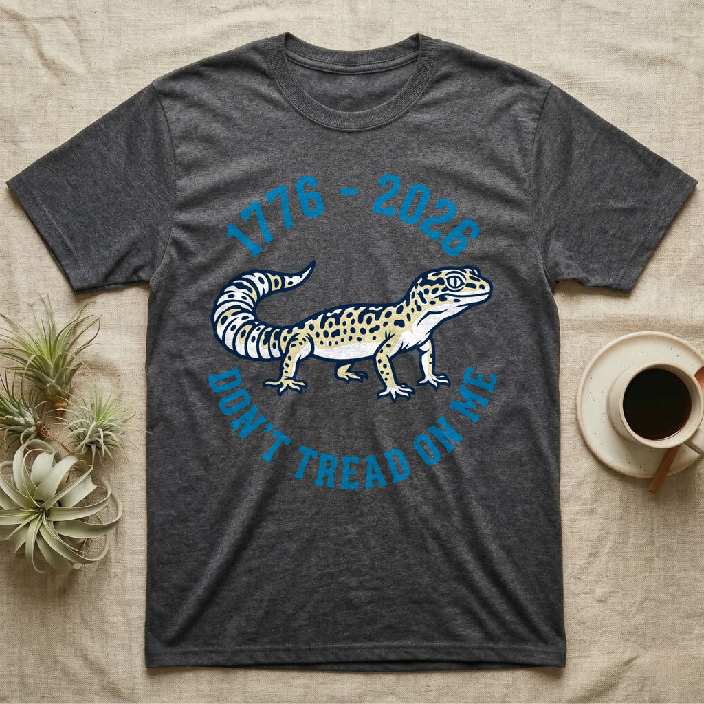 Leopard Gecko 1776 T-Shirt in Dark Heather — Two-colour vector leopard gecko in profile ringed by arched text reading 1776 to 2026 and Don't Tread On Me.