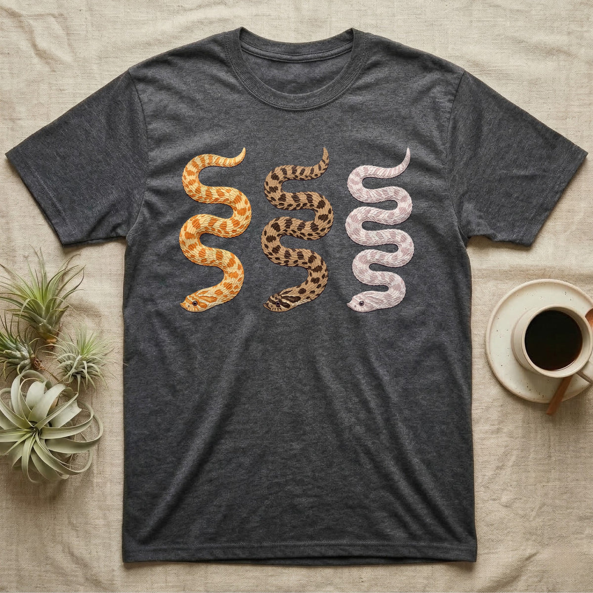 Hognose Morph Triptych T-Shirt in Dark Heather — Palette-knife painting of three western hognose snakes side by side, albino, anaconda and snow morphs.