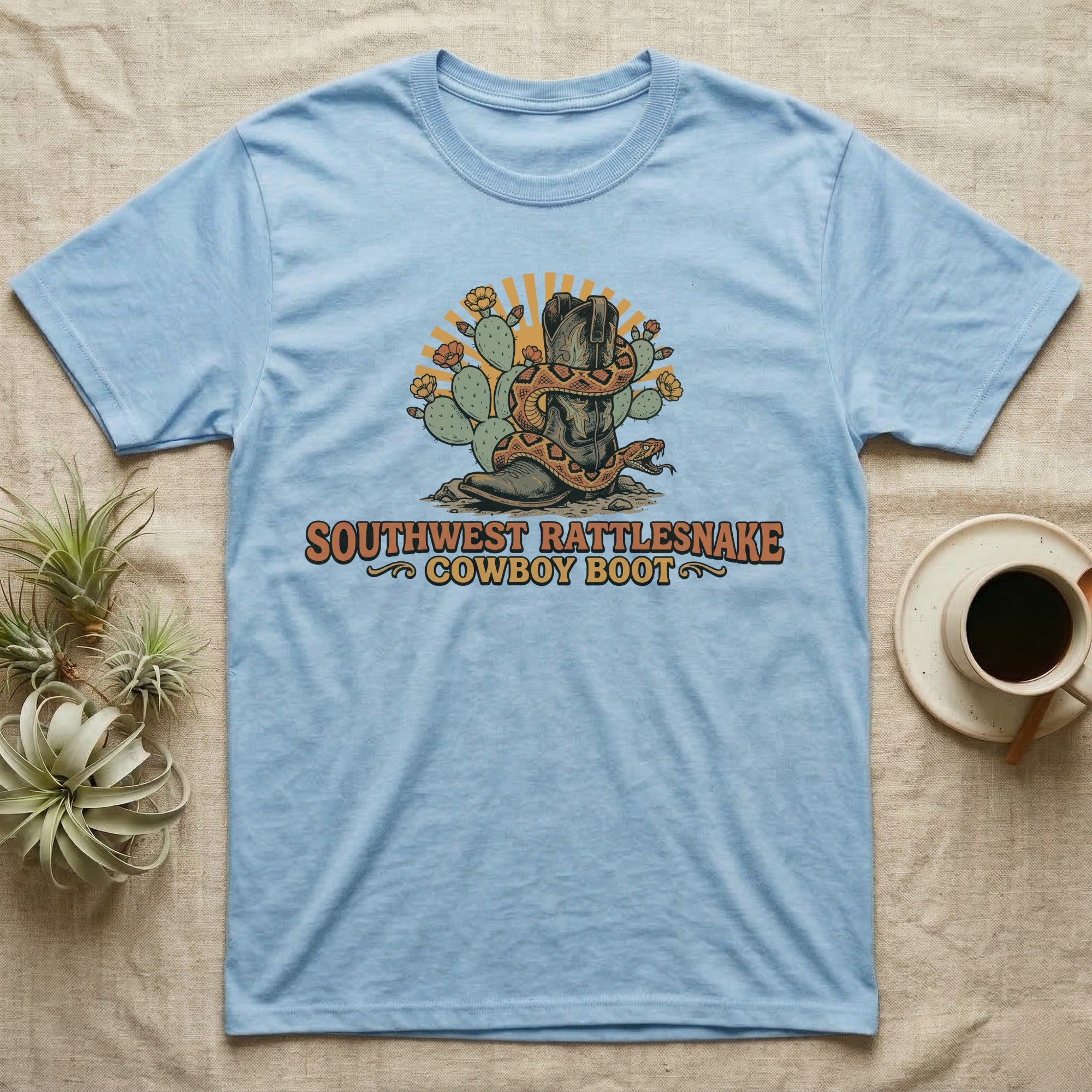 Light blue t-shirt with "SOUTHWEST RATTLESNAKE COWBOY BOOT" graphic.
