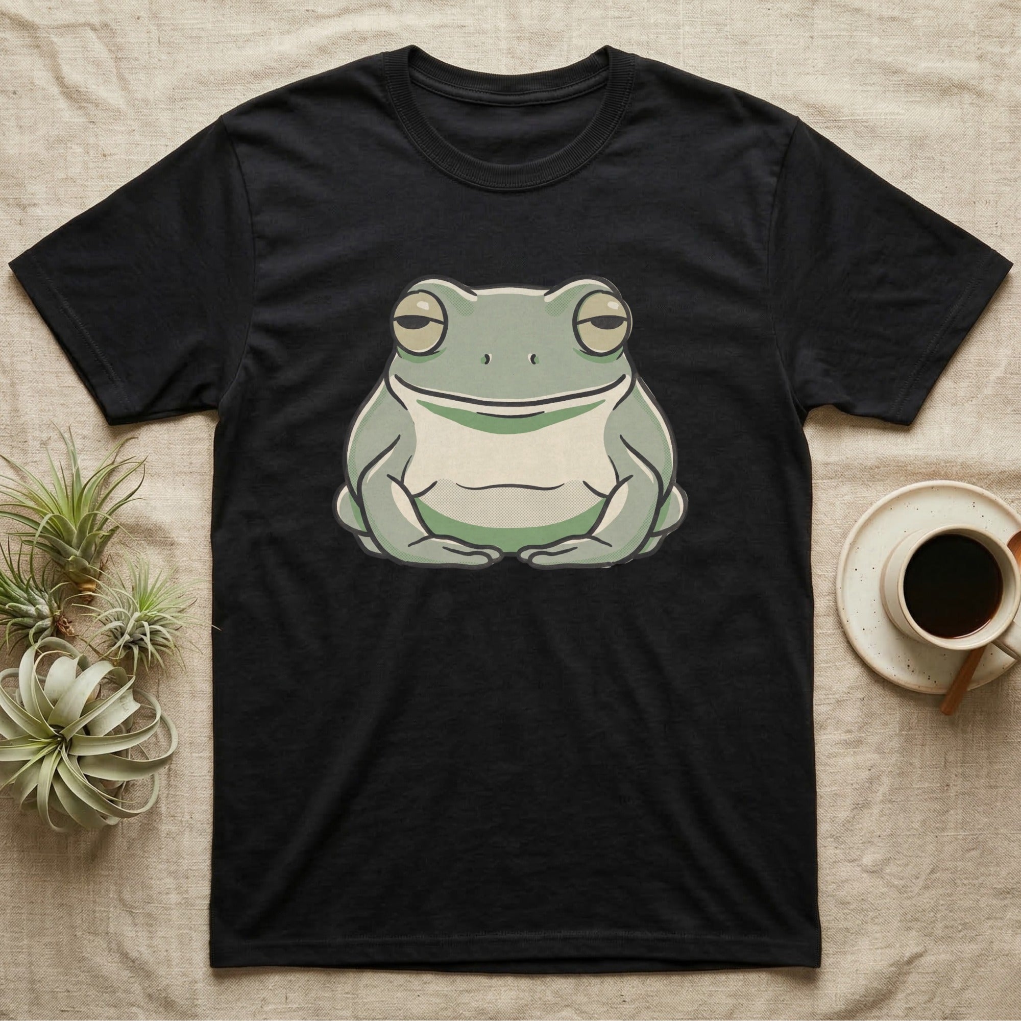 Tree Frog Deadpan T-Shirt in Black — Bold vector portrait of a White's tree frog with a flat deadpan expression and a naturally smiling mouth line.