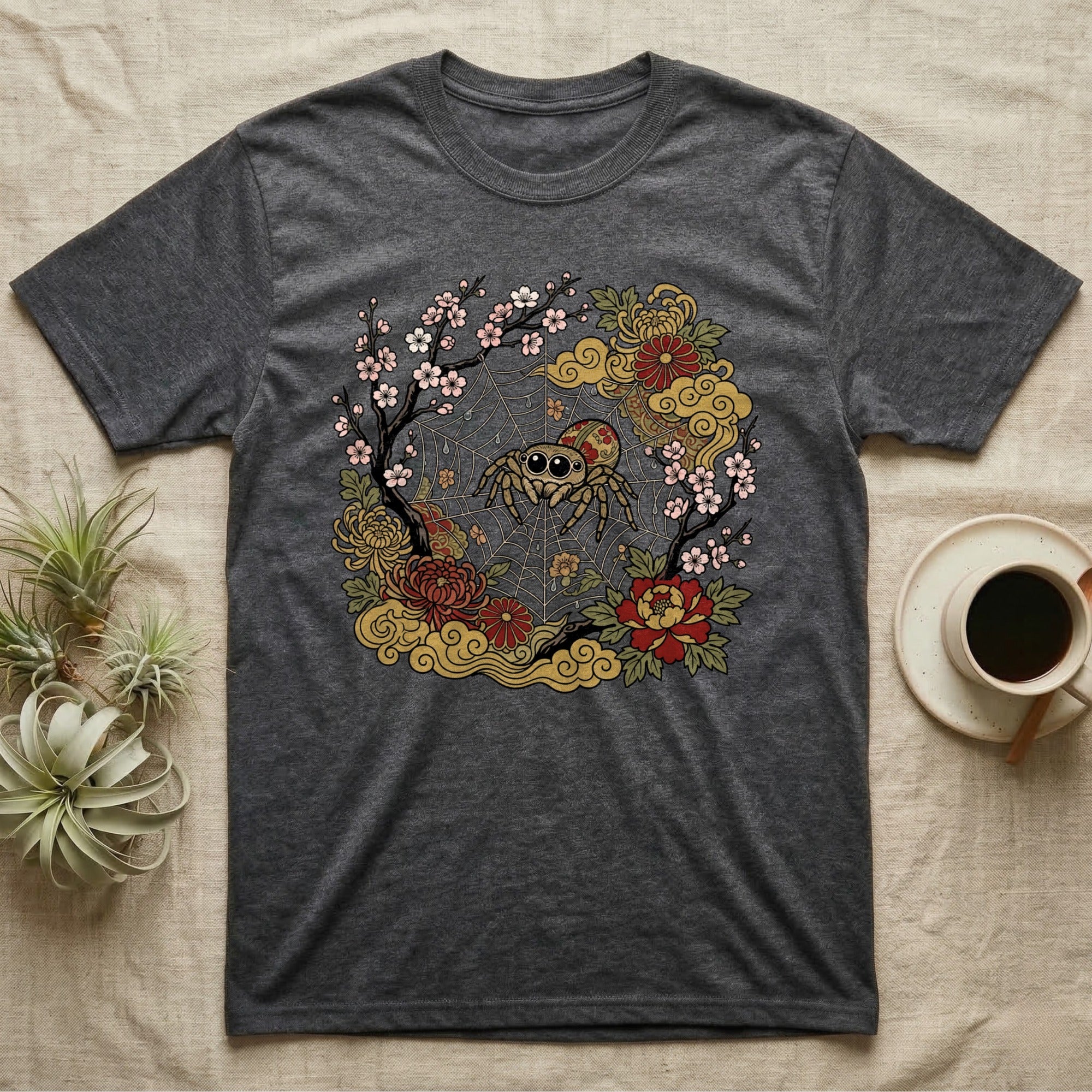 Charcoal t-shirt with a circular design of a jumping spider and floral elements.