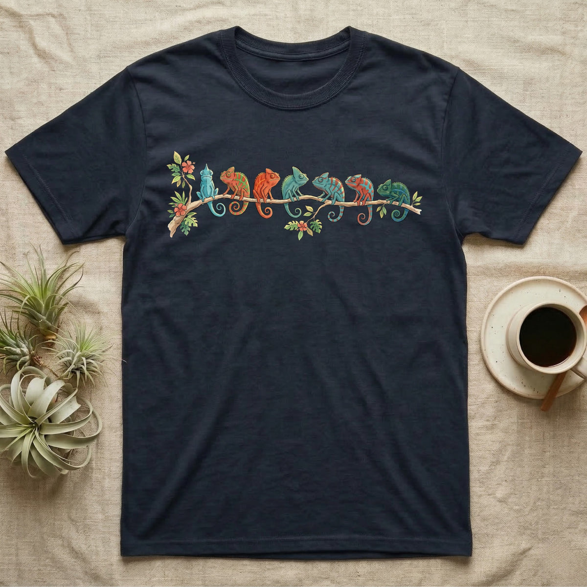 Panther Chameleon Canopy Crew T-Shirt in Navy — Watercolor illustration of seven panther chameleons in Madagascar locale colours on a branch, dark grey T-shirt design.