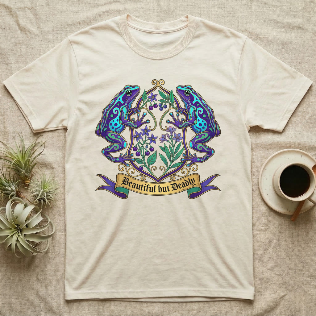 Cream t-shirt with detailed blue and purple frog crest, "Beautiful but Deadly" banner.